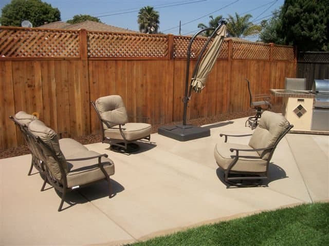 Finished concrete patio in a residential backyard