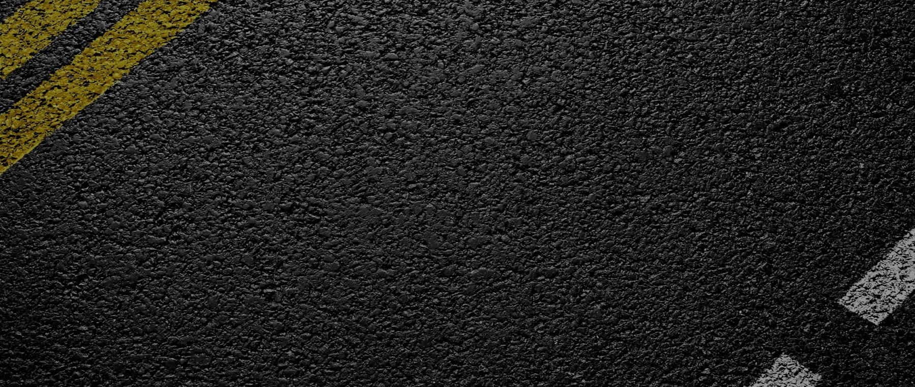 Close-up of dark asphalt pavement surface